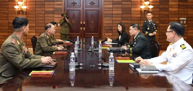 South Korean and North Korean officials hold working-level military talks at the truce village of Panmunjom on Sept. 13, in this photo provided by Seoul's defense ministry. (Yonhap)