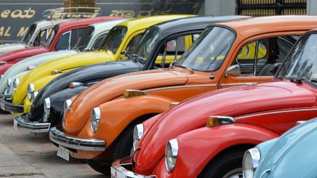 Vintage Volkswagen Beetle cars are parked in a row. (AFP)