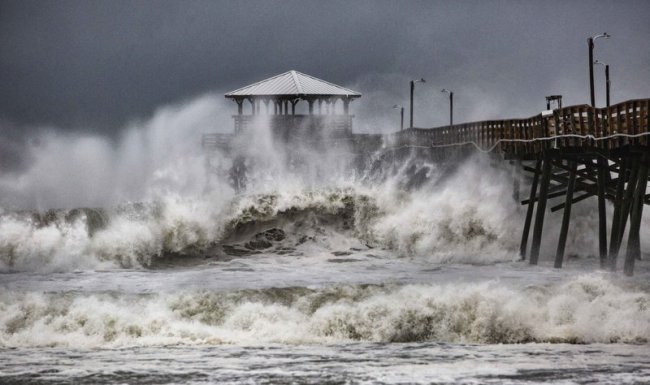 Waves slam the Oceana Pier & Pier House Restaurant in Atlantic Beach, N.C., Thursday, Sept. 13 as Hurricane Florence approaches the area. (AP)