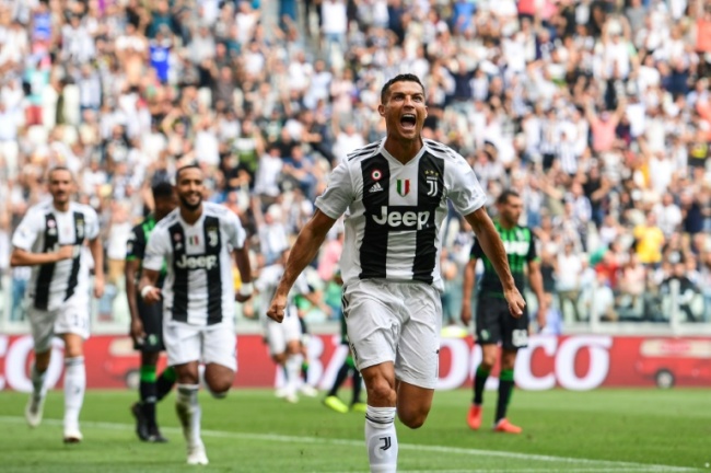 Double delight: Cristiano Ronaldo scored his first goals for Juventus in a 2-1 over Sassuolo in Turin. (AFP)