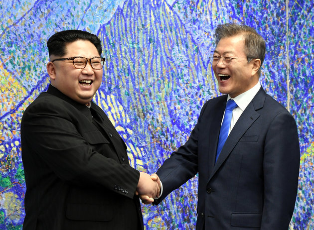 North Korea`s leader Kim Jong-un shakes hands with President Moon Jae-in during their summit in border village of Panmunjeom in April. Yonhap