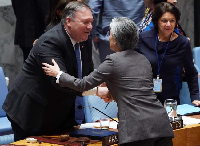 South Korea's Foreign Minister Kang Kyung-wha (R) greets US Secretary of State Mike Pompeo after the United Nations Security Council meeting on North Korea, Sept. 27, at the United Nations in New York. (AFP-Yonhap)