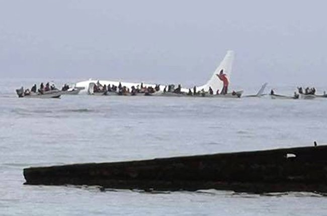 This photo provided by Blue Flag Construction shows an Air Niugini plane floating in Pacific lagoon after its crash-landing in Pacific lagoon near Chuuk Airport in Weno, Federated States of Micronesia, Friday, Sept. 28. (AP)