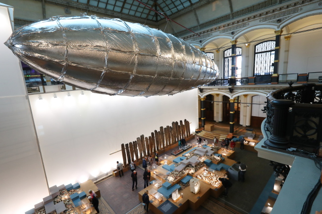 The installation 'Willing to be vulnerable' by artist Lee Bul hangs in the main hall of the Martin Gropius Bau as part of the exhibition 'Lee Bul: Crash' at the Martin Gropius Bau in Berlin on Friday. (EPA-Yonhap)