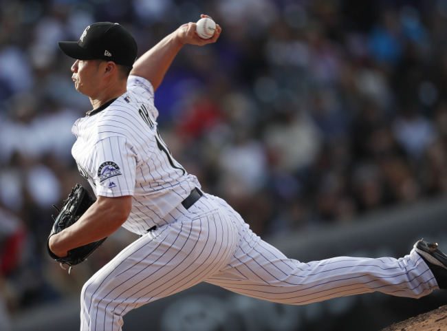 Oh Seung-hwan of the Colorado Rockies throws a pitch against the Washington Nationals in the top of the eighth inning of a Major League Baseball regular season game at Coors Field in Denver on Sept. 30. (AP)