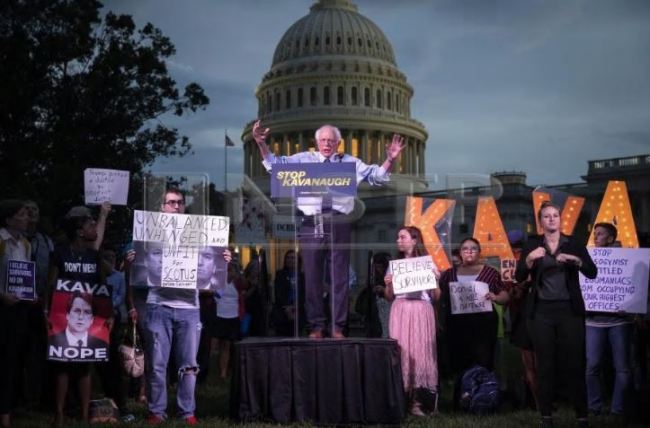US Sen. Bernie Sanders (I-VT) speaks to protestors rallying against Supreme Court nominee Judge Brett Kavanaugh on Capitol Hill, Oct. 4, in Washington, DC. (AFP)