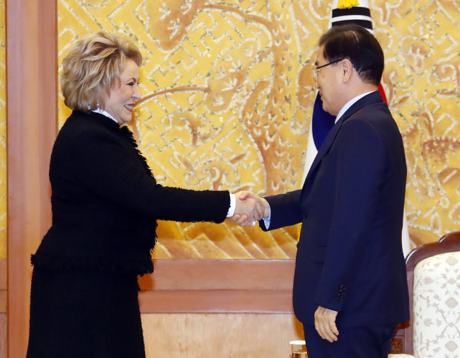 Valentina Matviyenko, chairwoman of Russia’s Federation Council,shakes hands with Seoul’s National Security Office chief Chung Eui-yong at the presidential office in Seoul on Friday. Yonhap