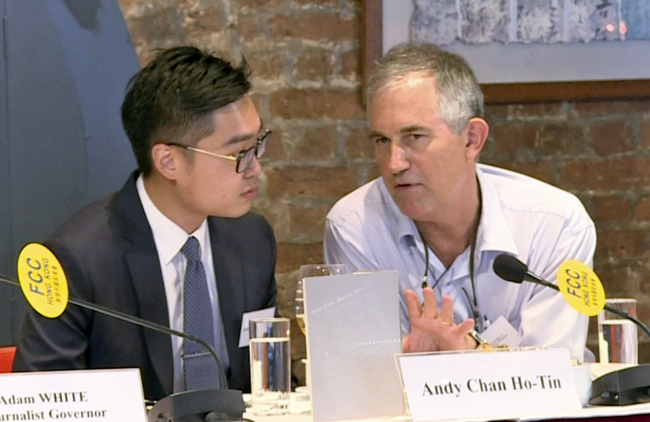 In this Aug. 14, 2018, image made from a video, The Financial Times Asia news editor, Victor Mallet, right, speaks with Andy Chan, founder of the Hong Kong National Party, during a luncheon at the Foreign Correspondents Club in Hong Kong. (AP-Yonhap)