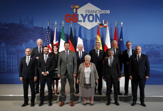 From left, British Home Secretary Sajid Javid, Jean-Marc Chataigner, Ambassador and French Special Envoy for Sahel, Italian Interior Minister Matteo Salvini, US Secretary Homeland Security Kirstjen Nielsen, German Ministry of the Interior Stephan Mayer, US Attorney General Jeff Sessions, French Minister attached to the Interior Minister Jacqueline Gourault, Moroccoan Interior Minister Abdelouafi Laftit, Spanish Interior Minister Fernando Grande-Marlaska, European Union Commissioner for Migration, Home Affairs and Citizenship Dimitris Avramopoulos, European Commissioner for the Security Union Julian King, Polish Interior Minister Joachim Brudzinski, attend a family picture at the G6 Interior Ministers’ meeting in Decines, near Lyon, central France, Tuesday, Oct. 9, 2018. (AP)