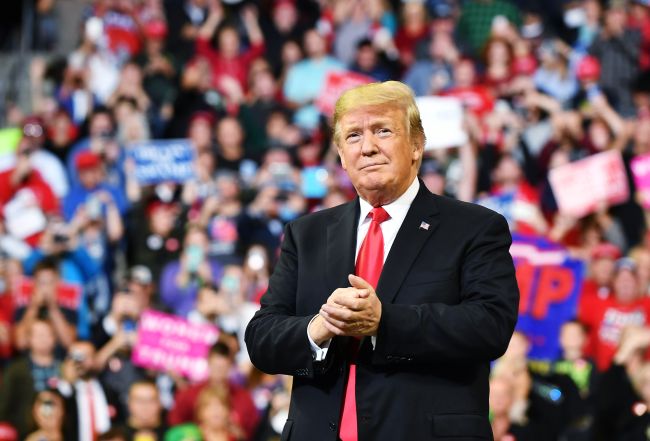 US President Donald Trump arrives on stage for a rally at the Mid-America Center in Council Bluffs, Iowa on Oct. 9. (AFP)