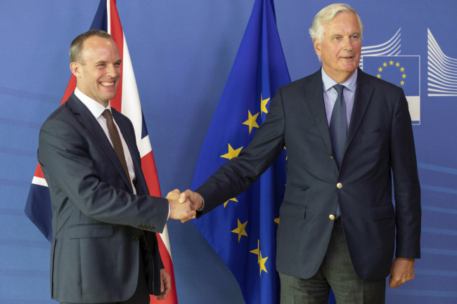 Britain's Brexit Secretary Dominic Raab, left, and EU chief Brexit negotiator Michel Barnier shaking hands (AP)