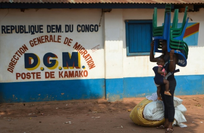 Humanitarian crisis group ACAPS asys that although the Angolan government "claims all returns are voluntary, there have been reports of forced returns," and migrants (AFP)