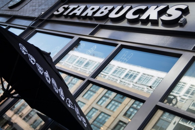 Starbucks is written in sign language on an umbrella outside the new "signing store" in Washington (AFP)