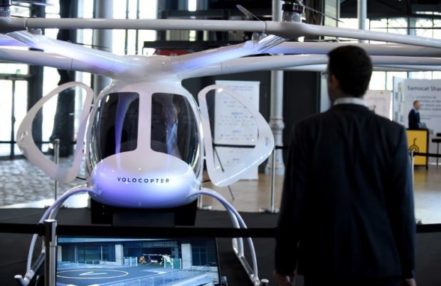 In this file photo taken on October 18, 2018, an electric Volocopter 2X by German aircraft manufacturer Volocopter, is on display during the 3rd edition of the “Autonomy and the Urban Mobility Summit” in Paris (AFP)