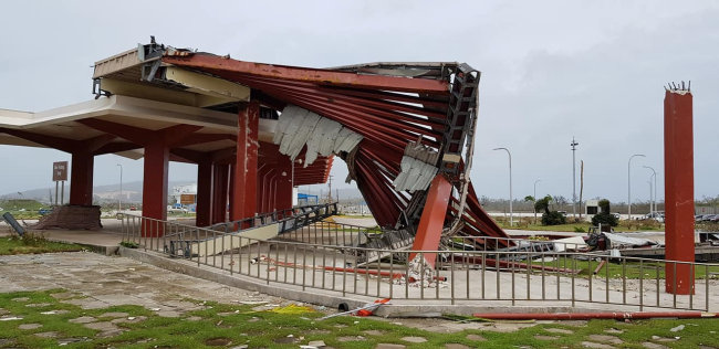 A damaged structure is seen at Saipan International Airport after Super Typhoon Yutu hit the Northern Mariana Islands, US, October 25, 2018 in this image taken from social media. (Reuters)