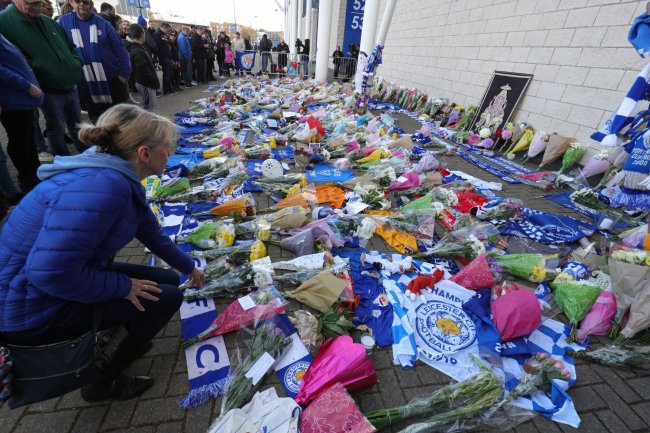 Flowers are placed outside Leicester City Football Club after a helicopter crashed in flames the previous day, in Leicester, England, Sunday, Oct. 28. (AP)