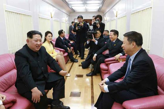 Song Tao, head of the international liaison department of the Central Committee of the Communist Party in China (right) speaking with North Korean leader Kim Jong-un during his visit in April, 2018 (KCNA via Yonhap)