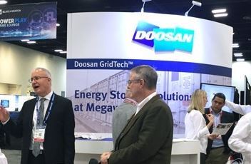 This photo provided by Doosan Heavy Industries & Construction Co. shows participants near its booth at DistribuTECH 2018 in Texas on Jan. 28, 2018. (Yonhap)