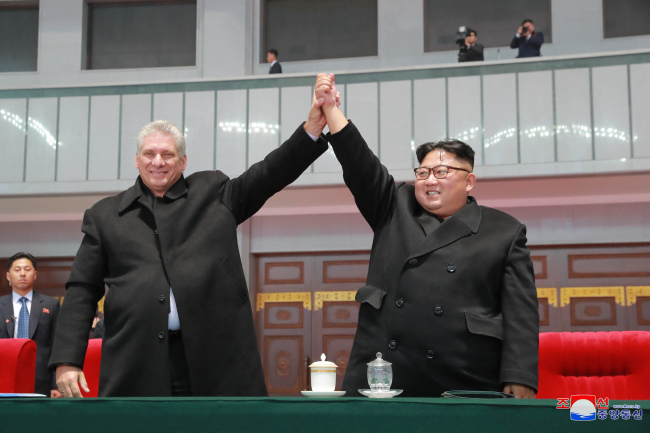 North Korean leader Kim Jong-un (right) and Cuban President Miguel Diaz-Canel watches the mass games performance of "The Glorious Country" at May Day Stadium in Pyongyang on Nov. 5. (KCNA)