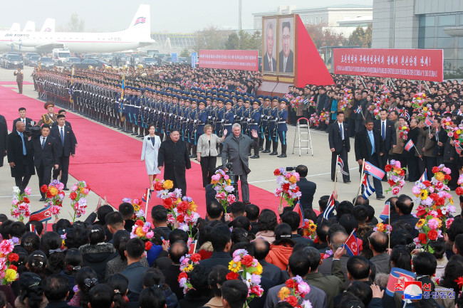 A portrait of Kim Jong-un appeared alongside that of Cuban President Miguel Díaz-Canel at Pyongyang International Airport, in a photo released by the Korean Central News Agency on Wednesday. (KCNA)