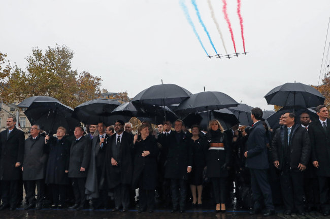 Spain's King Felipe VI, the President of the European Commission Jean-Claude Juncker, Lithuania's President Dalia Grybauskaite, Denmark's Prime Minister Lars Lokke Rasmussen, Morocco's Prince Moulay Hassan, Moroccan King Mohammed VI, German Chancellor Angela Merkel, French President Emmanuel Macron and his wife Brigitte Macron and Canadian Prime Minister Justin Trudeau arrive at a commemoration ceremony for Armistice Day, 100 years after the end of World War One, at the Arc de Triomphe, in Paris, France. (Reuters)