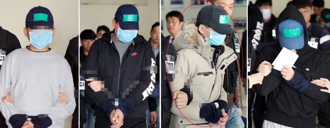 In this compilation photo, four teenagers are escorted to court on charges pertaining to the alleged bullying death of a classmate, Friday. One of the teenagers being charged (third from left) wore a jacket that had belonged to the victim. (Yonhap)