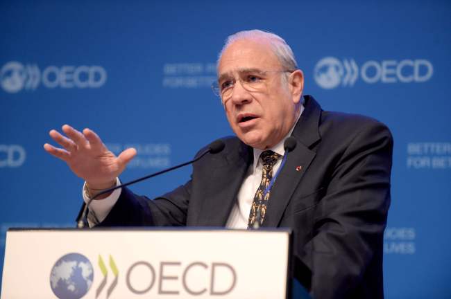 Secretary-General of the Organisation for Economic Cooperation and Development Jose Angel Gurria gestures as he addresses a press conference to present the latest economic outlook at the OECD headquarters in Paris on Wednesday. AFP