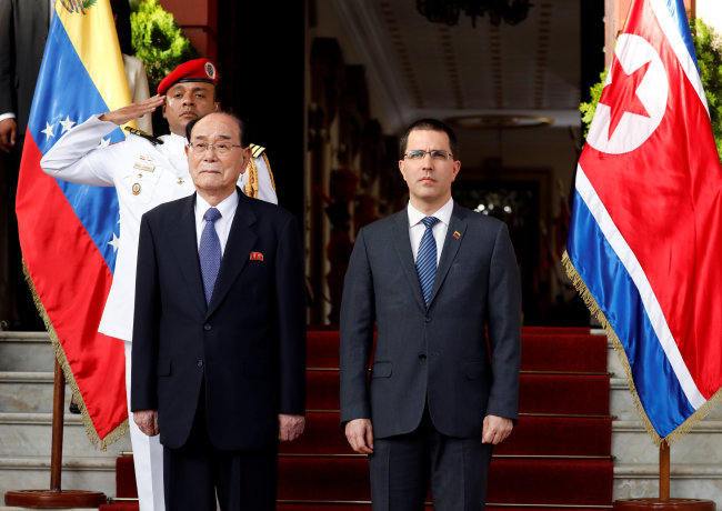 Kim Yong-nam, president of the Presidium of the Supreme People's Assembly (left), arrives in Venezuela, Nov. 28 (Yonhap)
