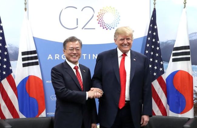 South Korean President Moon Jae-in (L) and U.S. President Donald Trump shake hands before the start of their bilateral talks held Nov. 30, 2018 on the sidelines of the Group of 20 Leaders' Summit in Buenos Aires. (Yonhap)