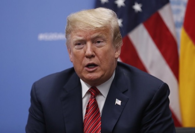 President Donald Trump speaks to media about the death of former President George H. W. Bush, during his meeting with Germany's Chancellor Angela Merkel at the G20 summit, Saturday, Dec. 1, 2018, in Buenos Aires, Argentina. (AP)