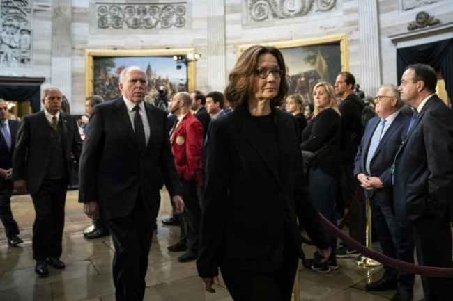 CIA Director Gina Haspel paid her respects at the casket of former president George H.W. Bush as he lay in state at the US Capitol, before she briefed US senators on Saudi Arabia's possible involvement in the murder of journalist Jamal Khashoggi (AFP)