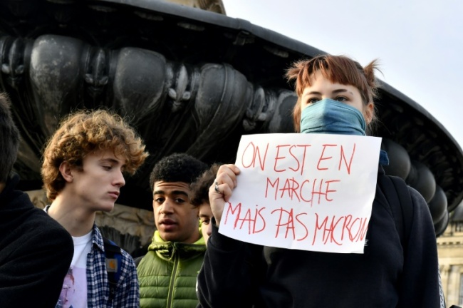 The protests began over fuel taxes but have widened into a broad challenge to Macron's pro-business agenda (AFP)