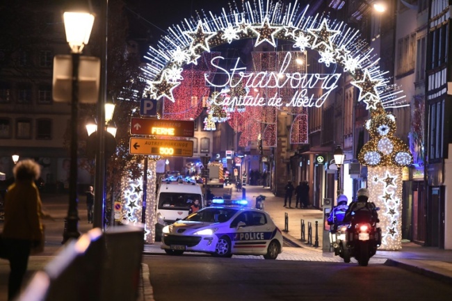 Shortly after the shooting, lines of police vehicles and ambulances streamed into the market area, under festive lights declaring the city the "capital of Christmas" (AFP)