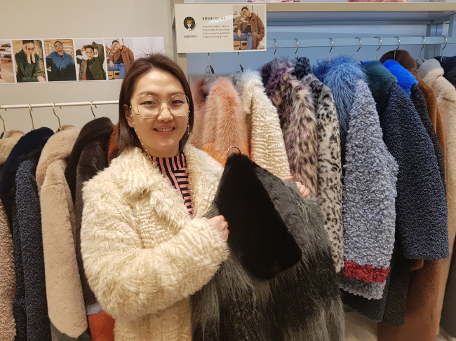 Vegan Tiger CEO Yang Yoon-a holds up a product. (Choi Ji-won/The Korea Herald)