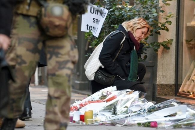 Messages of support for the victims, as well as candles and flowers, are multiplying in Strasbourg streets. (AFP)