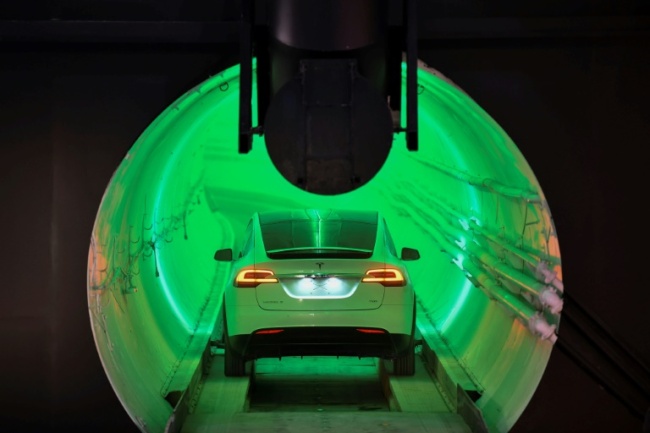 Elon Musk unveiled a sample tunnel, part of a vision for an underground network that cars can be lowered into then propelled along tracks at speeds up to 150 mph (241 kmh) (AFP)