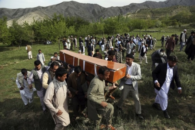 In this April 30, 2018 file photo, relatives, colleagues and friends of AFP chief photographer, Shah Marai, who was killed that day in a second suicide attack, carry his coffin in his village, Guldara, a district of Kabul province, Afghanistan. A New York-based organization dedicated to the safety of journalists says the deadliest country for journalists this year has been Afghanistan, where 13 journalists were killed. (AP)