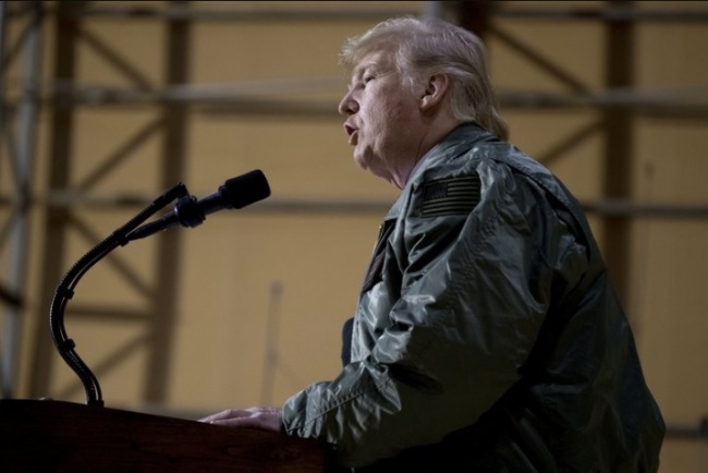 President Donald Trump speaks at a hanger rally at Al Asad Air Base, Iraq, Wednesday, Dec. 26, 2018. In a surprise trip to Iraq, President Donald Trump on Wednesday defended his decision to withdraw U.S. forces from Syria where they have been helping battle Islamic State militants. (AP)