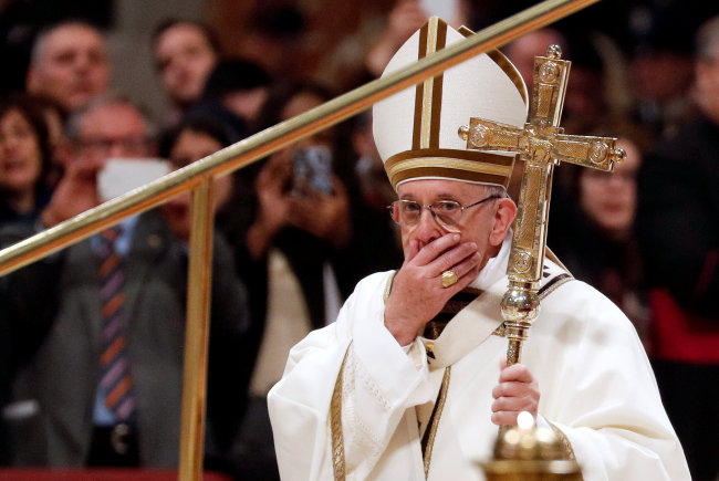 Pope Francis leaves at the end of the Mass for the Feast of Epiphany in Saint Peter's Basilica at the Vatican on Sunday. (Reuters-Yonhap)
