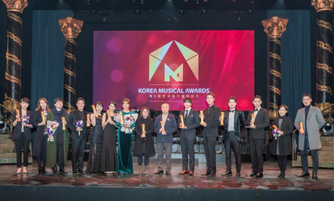 Winners hold their trophies at the third Korea Musial Awards at Blue Square in Seoul on Monday. (Yonhap)