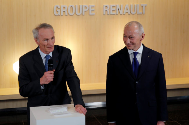 Jean-Dominique Senard, newly-appointed Chairman of Renault, and Thierry Bollore, newly-appointed Chief Executive Officer of Renault, talk to journalists after French carmaker Renault's board of directors meeting in Boulogne-Billancourt, near Paris, France, Thursday. (Reuters)
