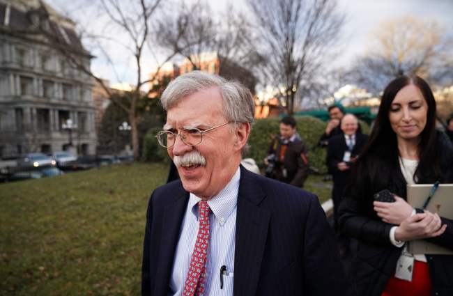 National Security Advisor John Bolton walks on the driveway of the White House after an interview in Washington, DC on Thursday. (AFP-Yonhap)