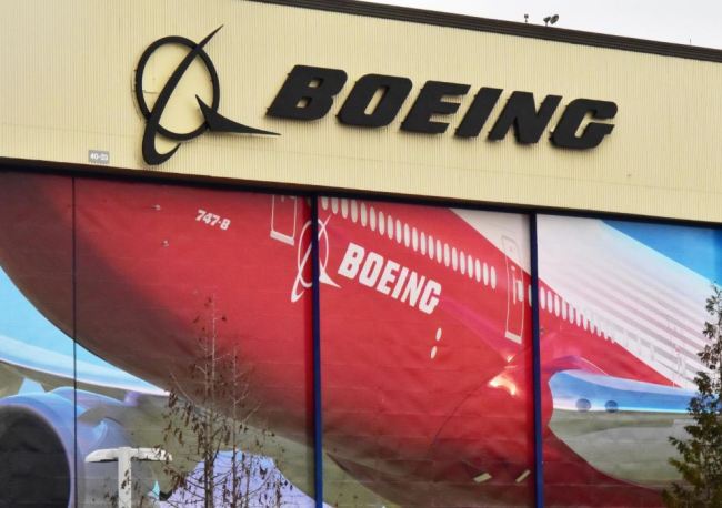 Boeing Co's logo is seen above the front doors of its largest jetliner factory in Everett, Washington, US January 13, 2017. (Reuters)