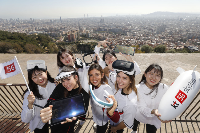KT employees show various products featuring KT's 5G services in time for the MWC 2019 being held in Barcelona, Spain, this week. (Yonhap)