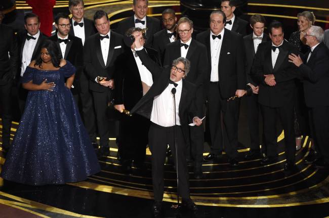 Peter Farrelly, center, and the cast and crew of "Green Book" accept the award for best picture at the Oscars on Sunday, Feb. 24, 2019, at the Dolby Theatre in Los Angeles. (AP)