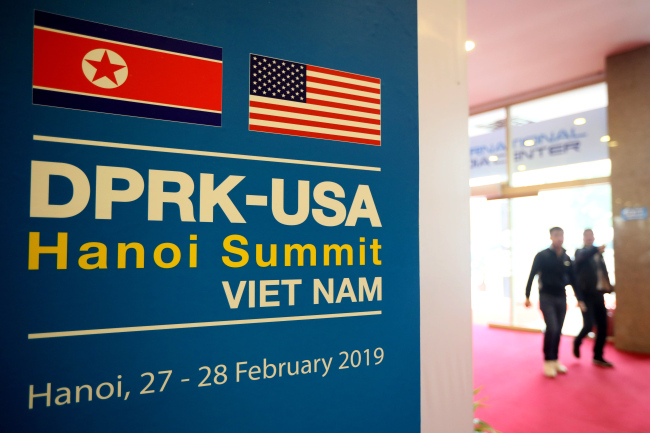 People walk at the International Media Center of the second US-North Korea summit, in Hanoi, Vietnam, 25 February 2019. The second meeting of US President Donald J. Trump and the North Korean leader Kim Ong-un, running from 27 to 28 February 2019, focuses on furthering steps towards achieving peace and complete denuclearization of the Korean peninsula. (Yonhap)