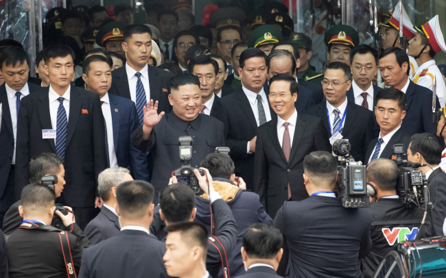 North Korean leader Kim Jong-un waves at Dong Dang Railway Station in Vietnam on Tuesday. Yonhap