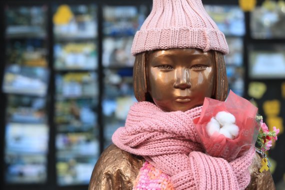 This file photo shows a statue of a girl, which is a symbol of the women forced into sexual slavery by Japan during World War II, set up in front of the Japanese Embassy in Seoul. (Yonhap)