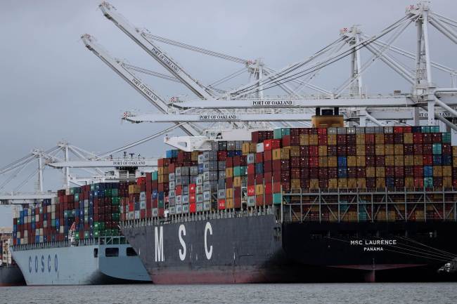 Container ships sit docked at the Port of Oakland on March 06, 2019 in Oakland, California. (AFP)