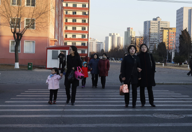 Women walk through the streets of downtown Pyongyang, North Korea, Thursday, March 7, 2019. (AP)